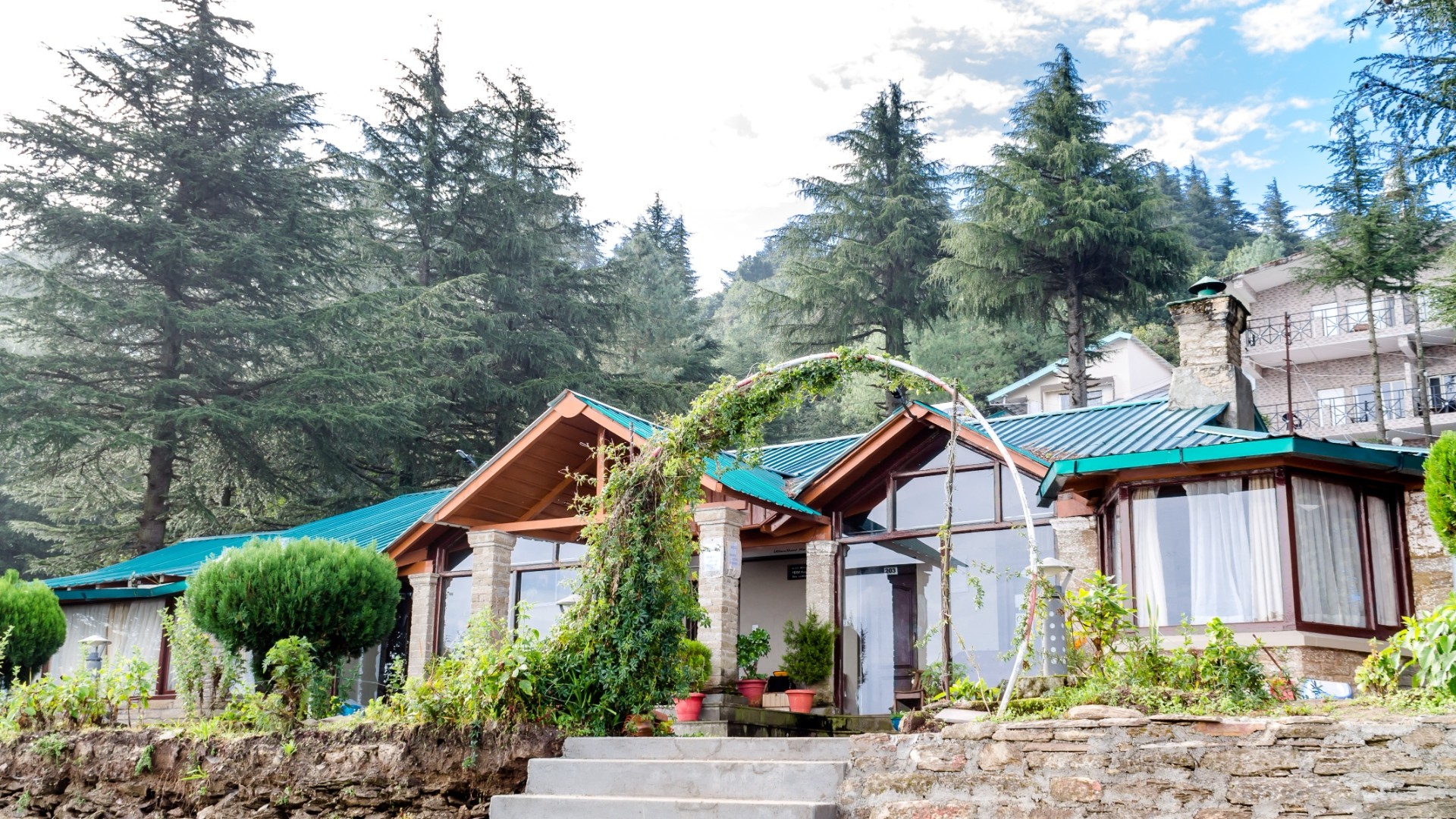 Well-maintained home exterior with lush landscaping and clean roofline