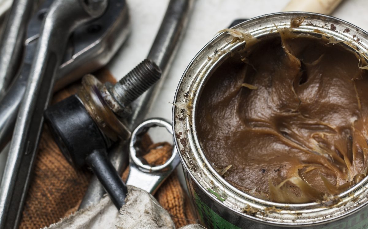 thick grease clings to metal where light oils drain away
